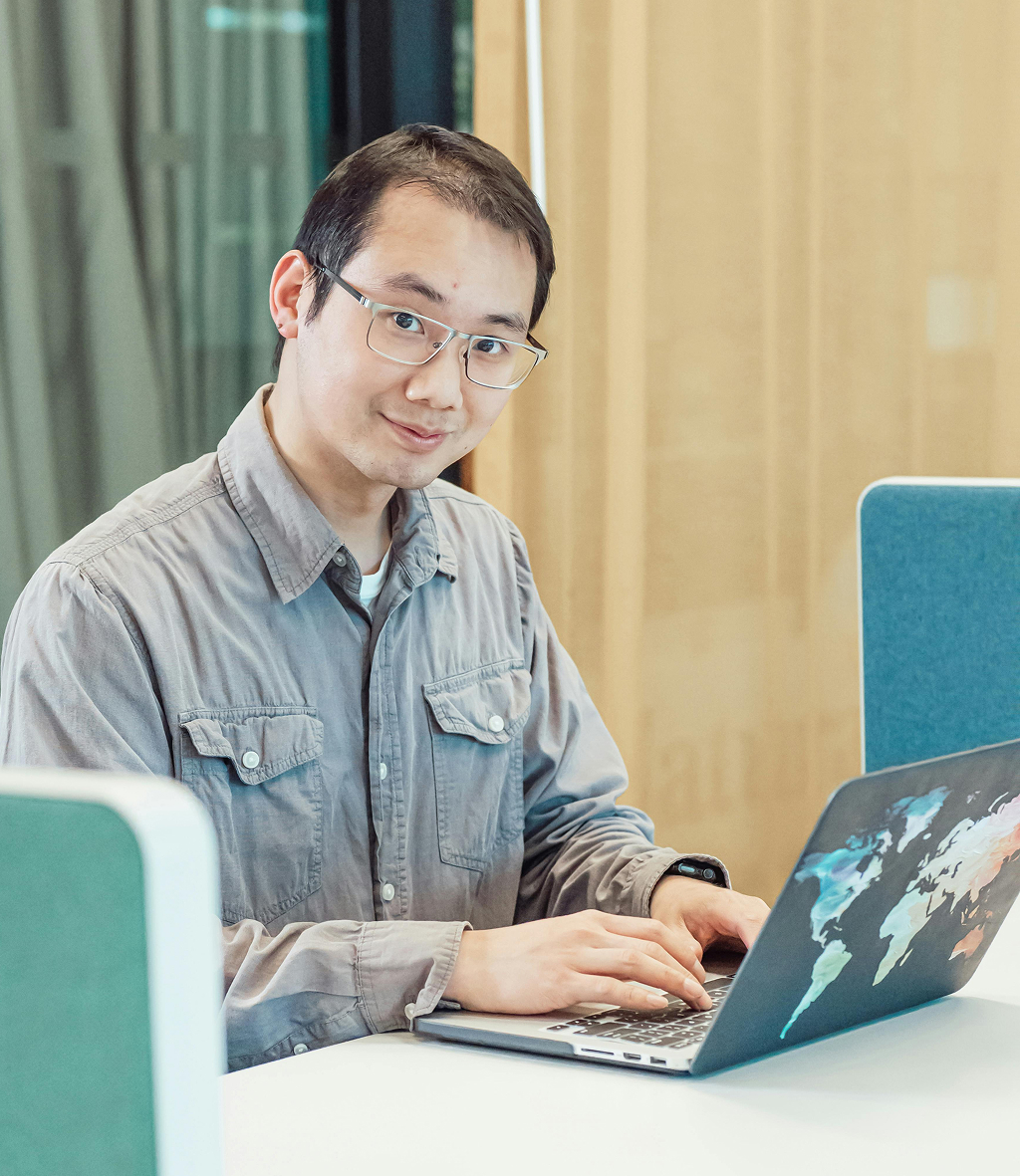 Offshore professional engaged in focused work at their workstation